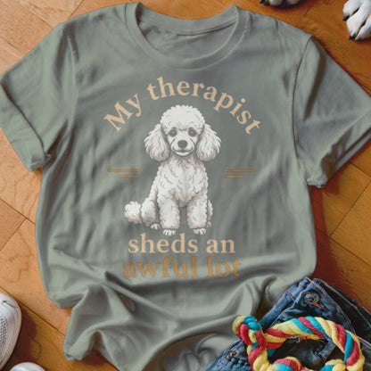 T-shirt graphic with white poodle and text "My therapist sheds an awful lot".