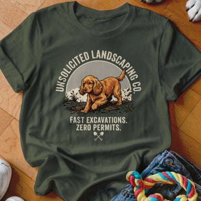 T-shirt graphic with a dog digging and text "Unsolicited Landscaping Co."