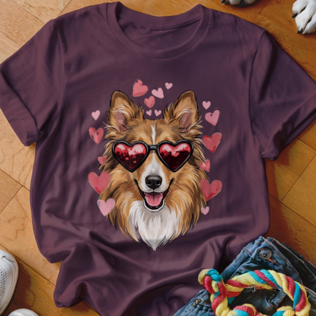 Maroon t-shirt featuring a graphic of a smiling dog wearing heart-shaped sunglasses, surrounded by pink hearts.
