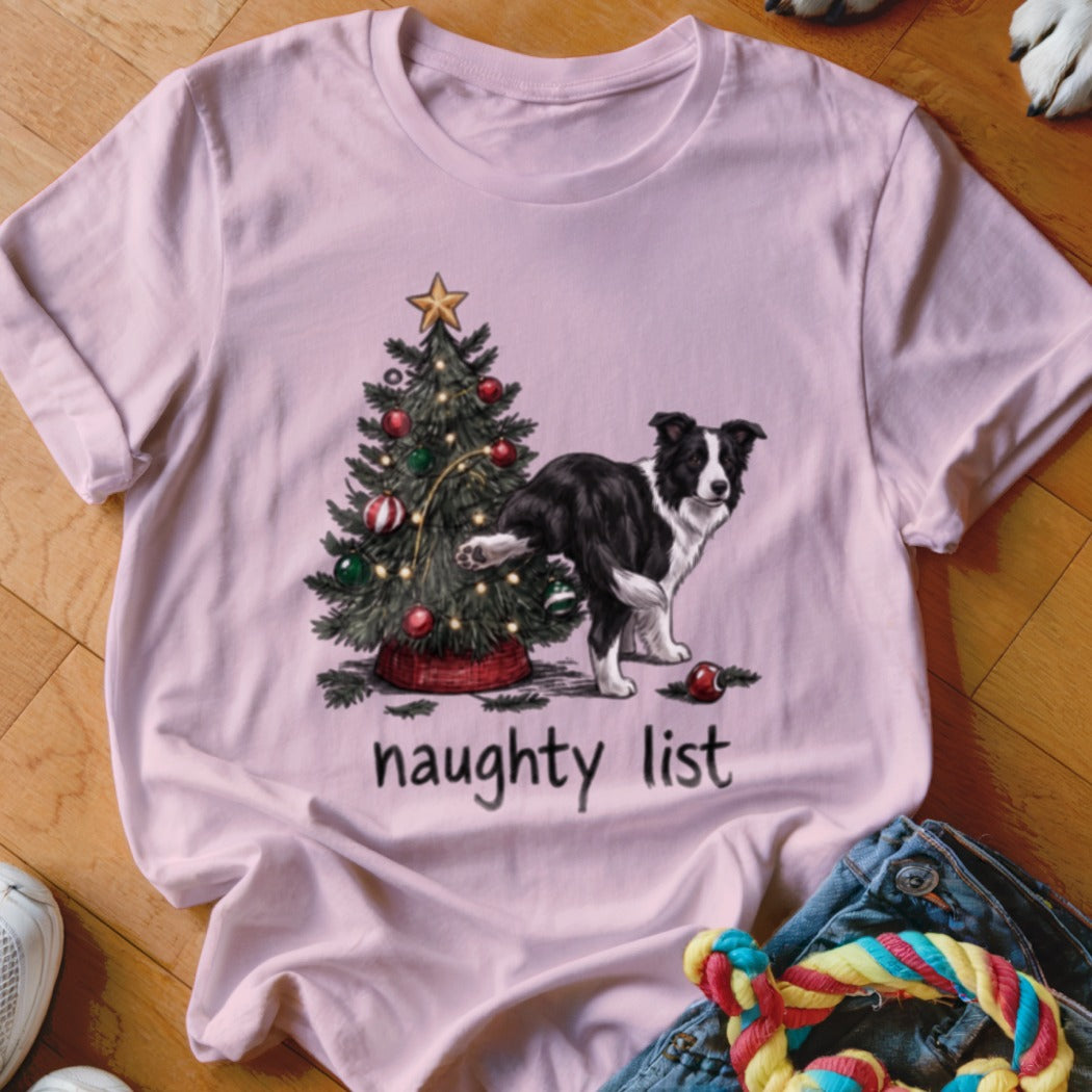 Border collie next to Christmas tree with text "naughty list."