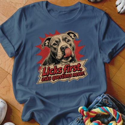 T-shirt with a pit bull licking its nose and the text "Licks first, asks questions never."