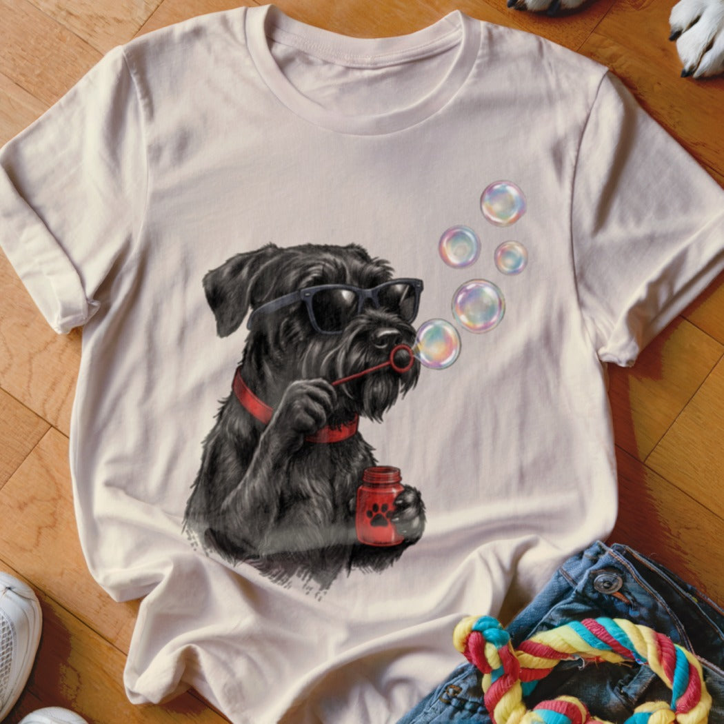 Light-colored t-shirt featuring a graphic of a black dog in sunglasses blowing bubbles.