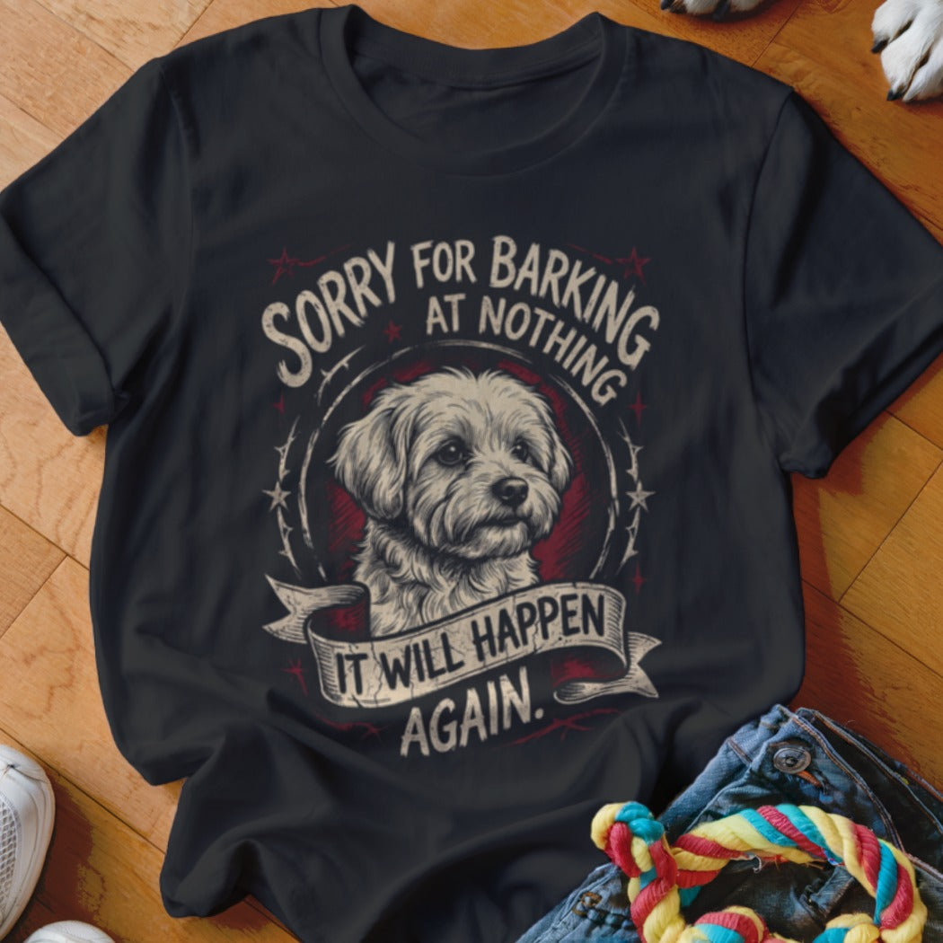 Black t-shirt featuring a graphic of a small dog and text that reads, Sorry for barking at nothing, it will happen again.