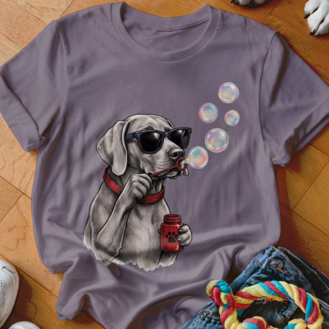 Purple crewneck t-shirt featuring a graphic of a dog wearing sunglasses and blowing bubbles.