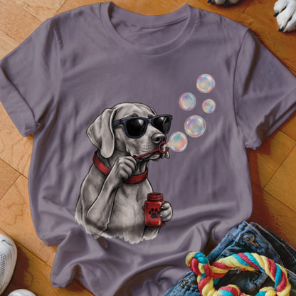 Purple crewneck t-shirt featuring a graphic of a dog wearing sunglasses and blowing bubbles.
