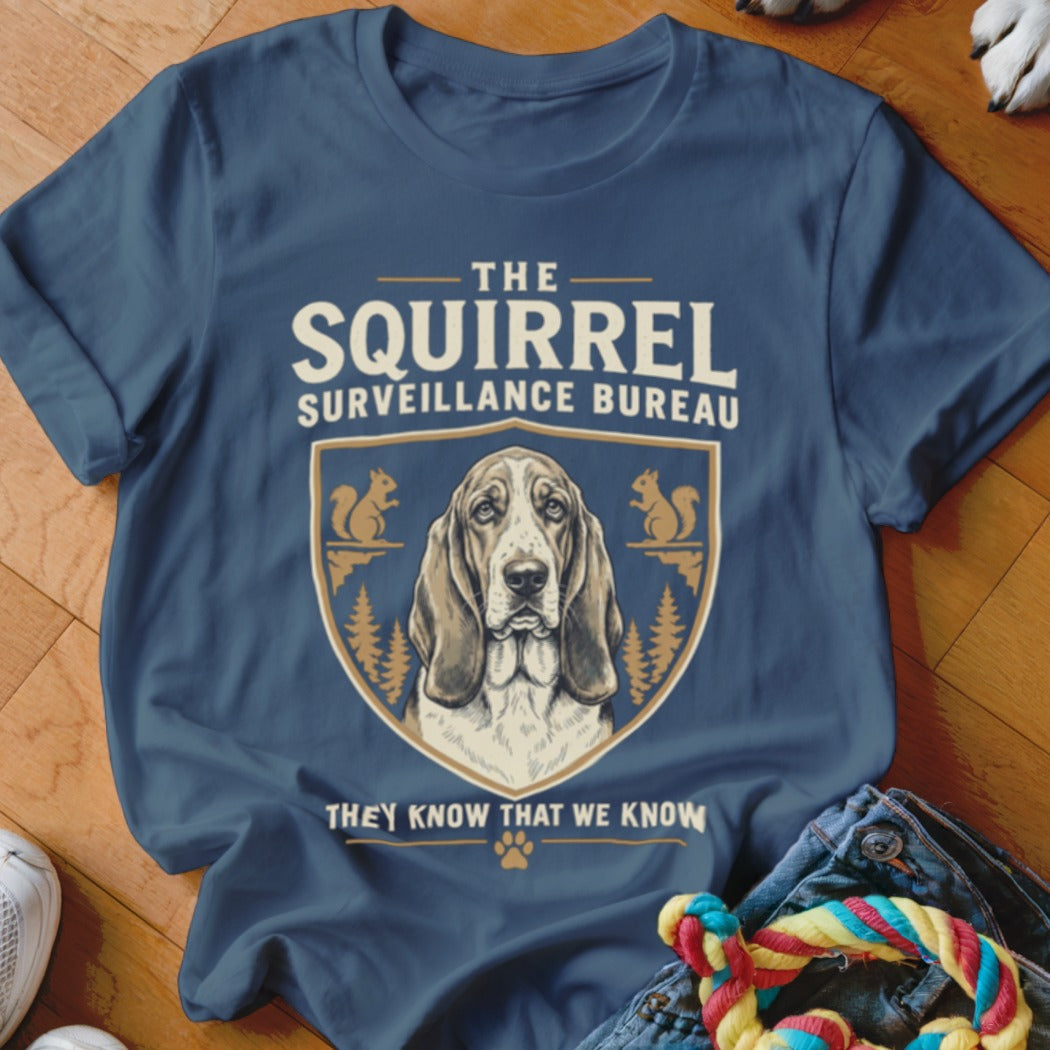 Navy blue t-shirt featuring a basset hound crest and the text The Squirrel Surveillance Bureau.