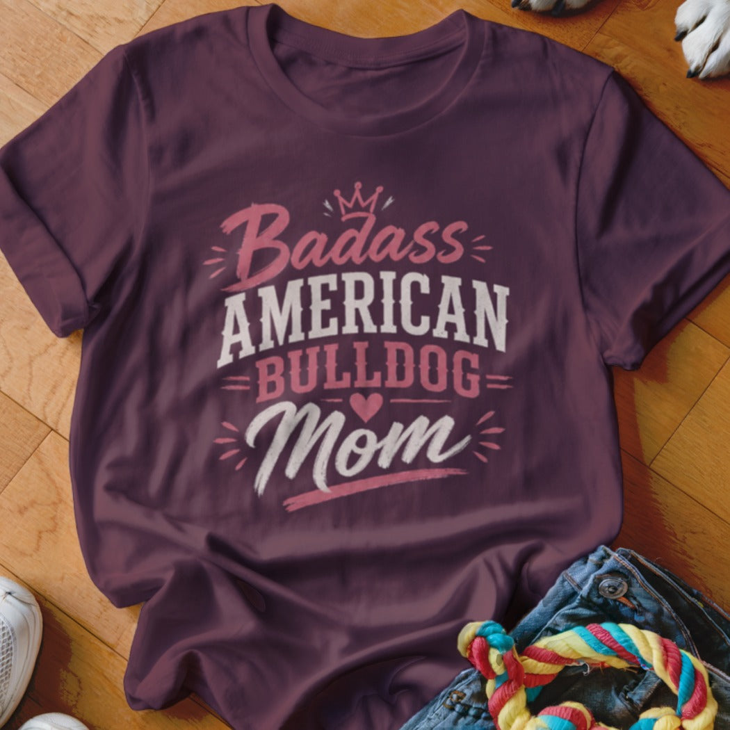 Maroon t-shirt with "Badass American Bulldog Mom" graphic design.