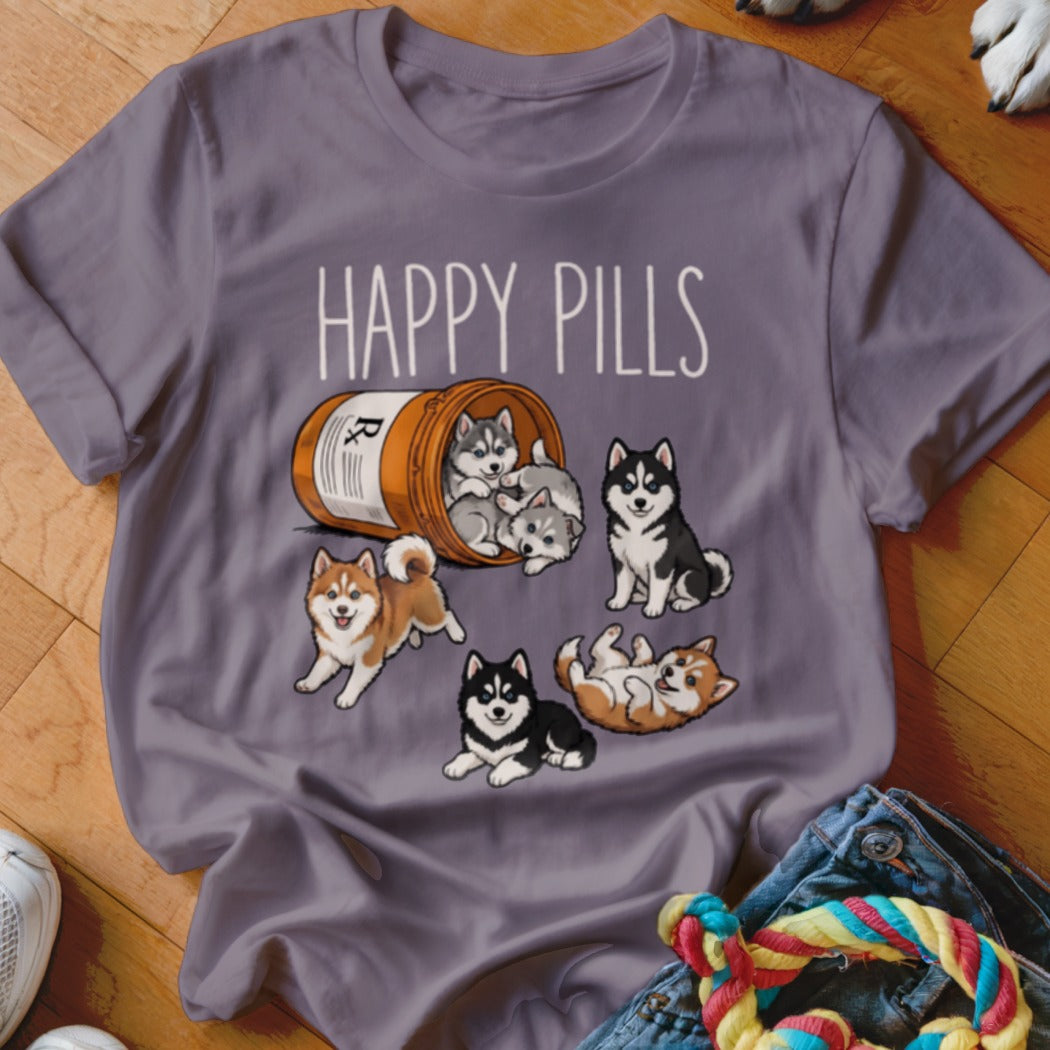 T-shirt with "Happy Pills" text and cartoon husky puppies spilling from a pill bottle.