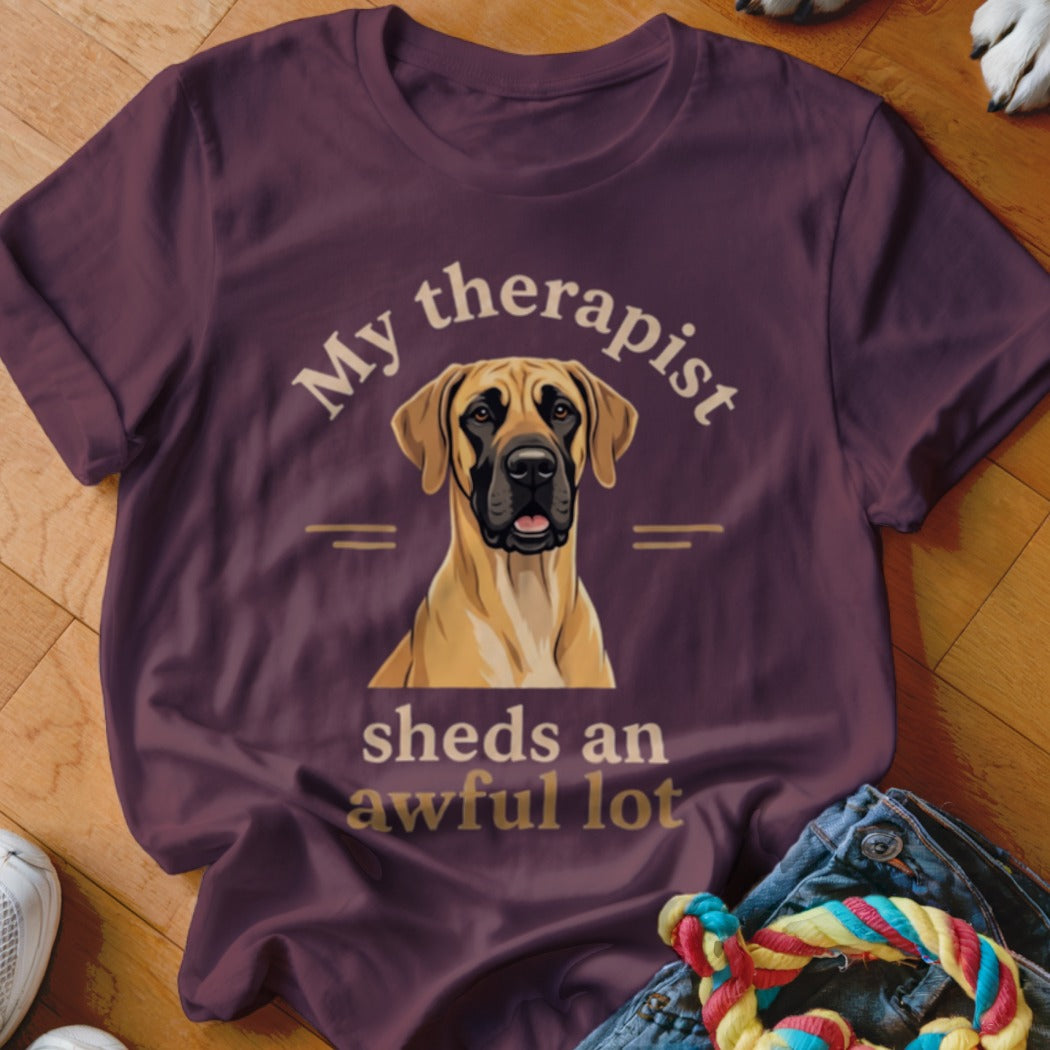 Great Dane wearing a t-shirt that says "My therapist sheds an awful lot."