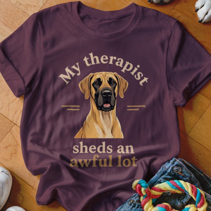 Great Dane wearing a t-shirt that says "My therapist sheds an awful lot."