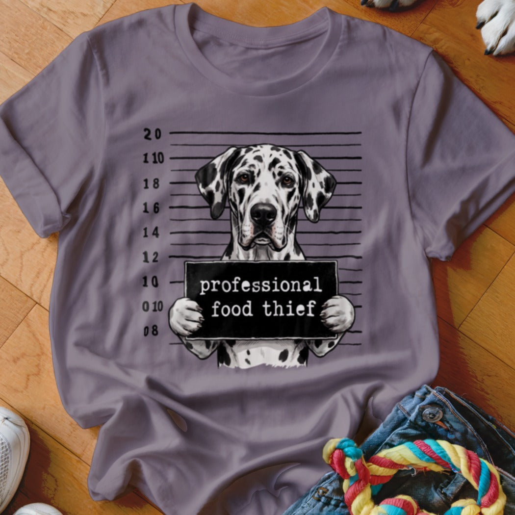 Dalmatian dog mugshot graphic with text "professional food thief" on a t-shirt.