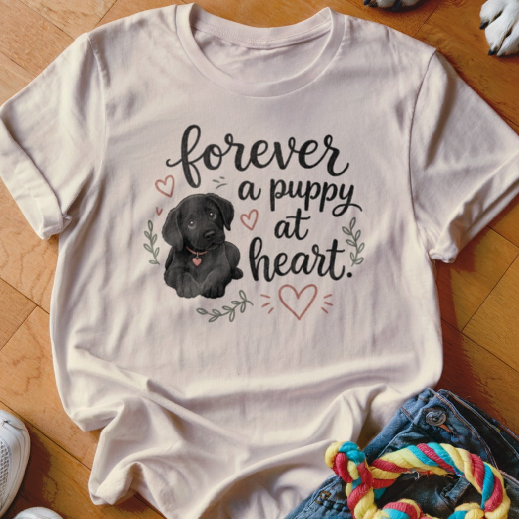 Cream t-shirt with black puppy and text "forever a puppy at heart".