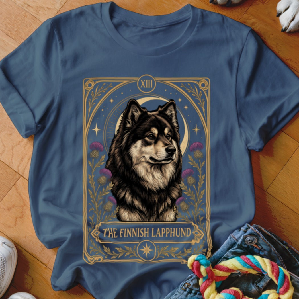 A dark blue t-shirt featuring a tarot card graphic of a Finnish Lapphund.