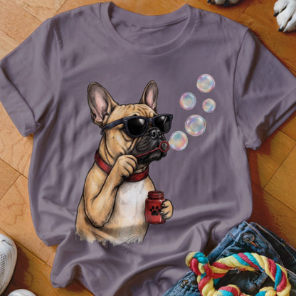 Purple crewneck t-shirt featuring a graphic of a French bulldog wearing sunglasses and blowing soap bubbles.