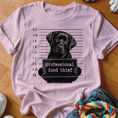 Pink t-shirt with black lab mugshot reading "professional food thief".