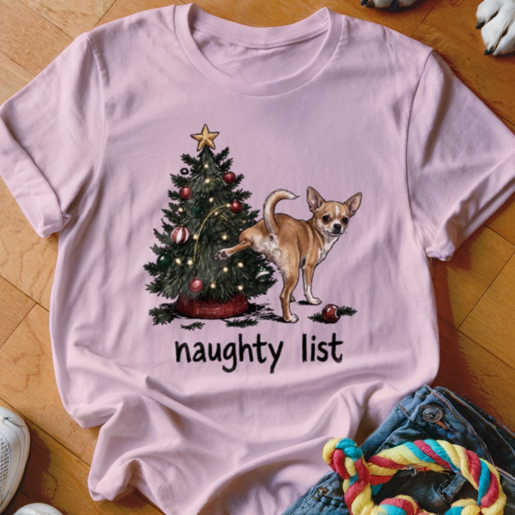 Light pink t-shirt with a chihuahua and Christmas tree graphic that reads "naughty list."
