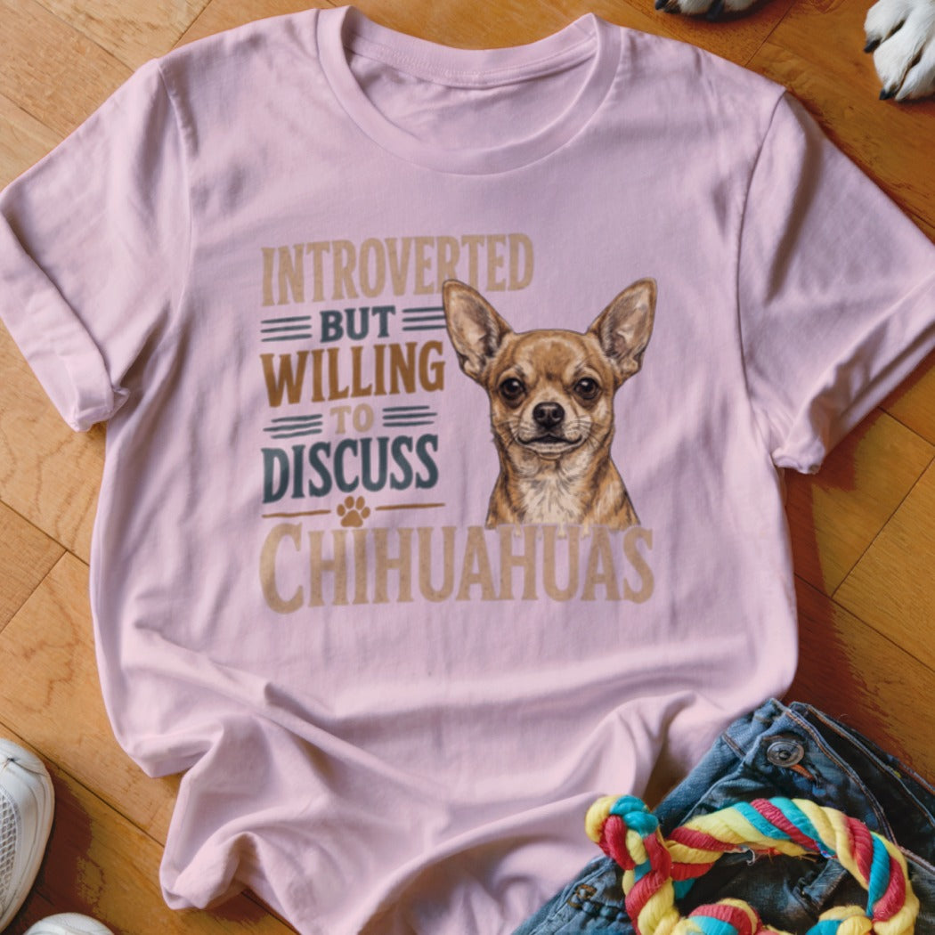 Pink t-shirt with chihuahua illustration and text "Introverted but willing to discuss Chihuahuas."