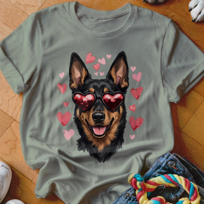 Sage green crewneck t-shirt featuring a graphic of a black and tan dog wearing heart-shaped sunglasses surrounded by pink hearts.