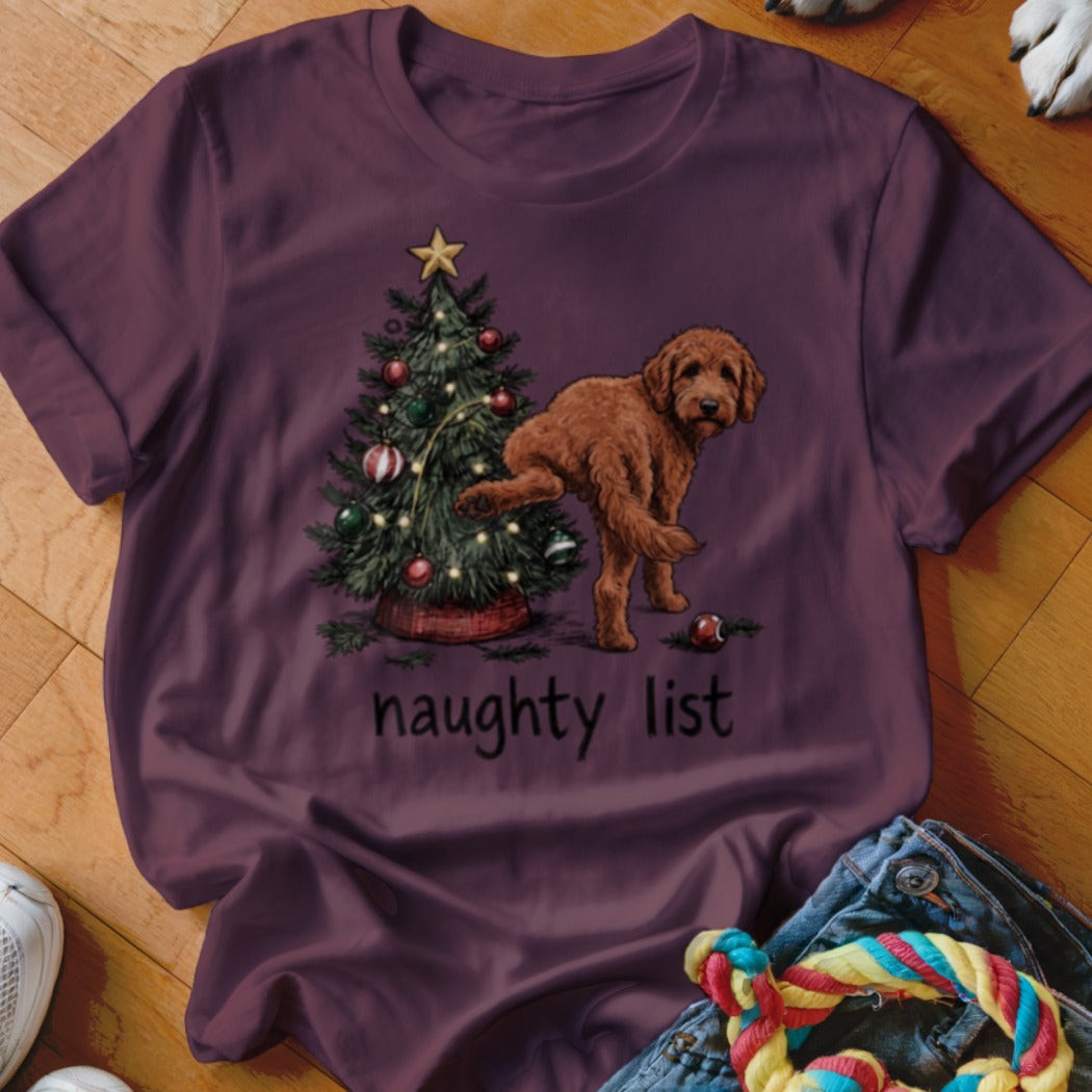 A brown dog stands near a Christmas tree with the text "naughty list."