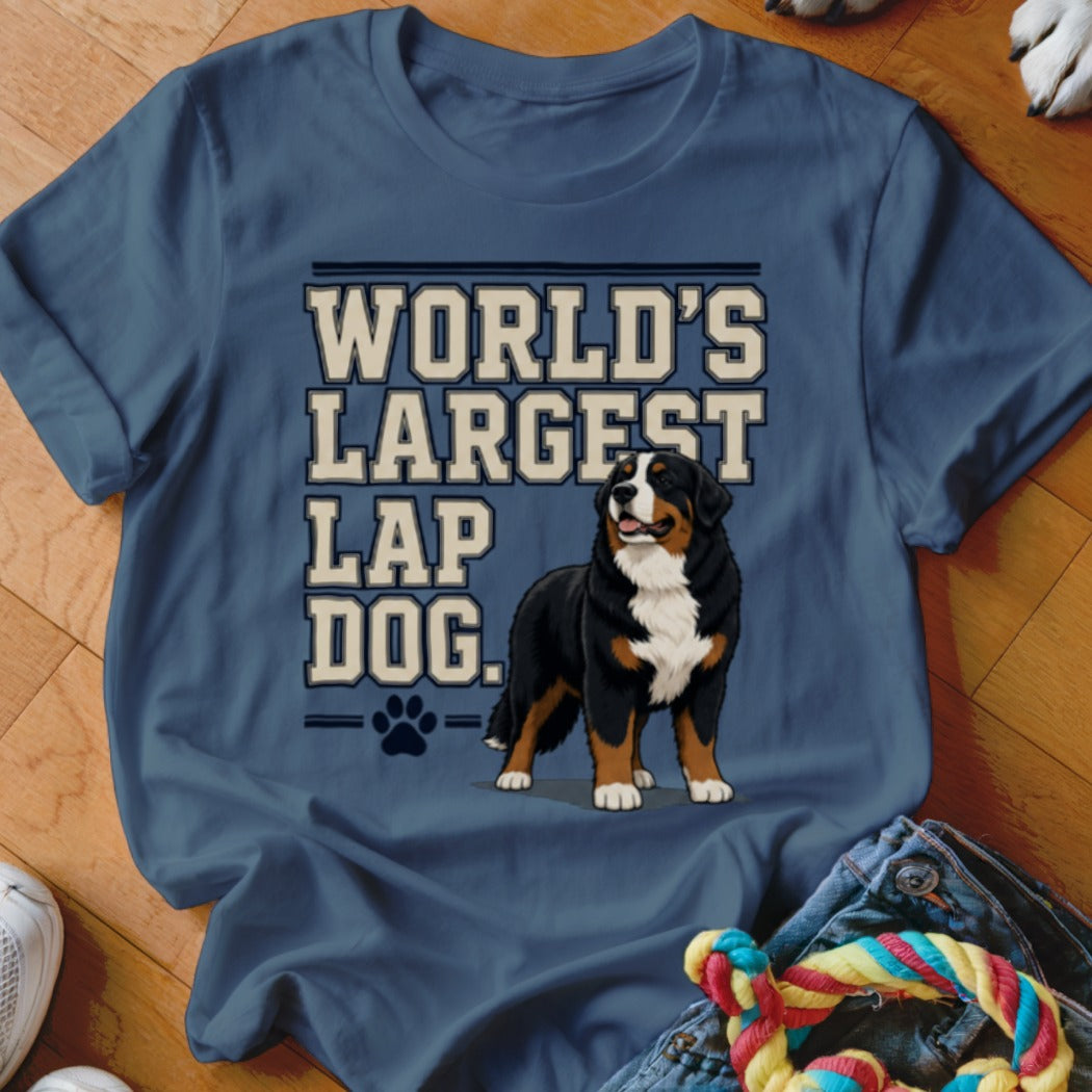 Bernese Mountain Dog and text "WORLD'S LARGEST LAP DOG." on blue t-shirt.