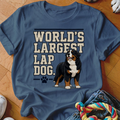 Bernese Mountain Dog and text "WORLD'S LARGEST LAP DOG." on blue t-shirt.