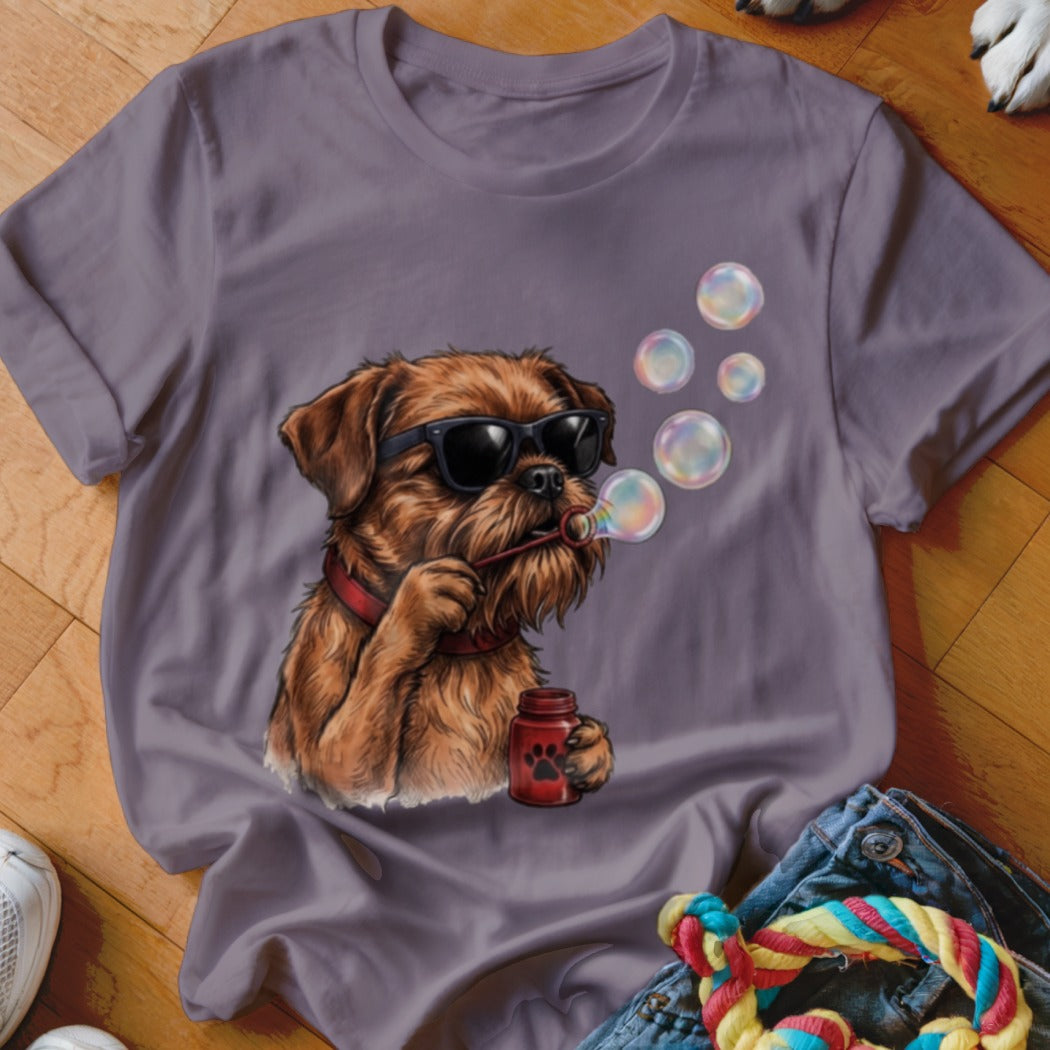 A purple t-shirt featuring a graphic of a brown dog wearing sunglasses and blowing bubbles.