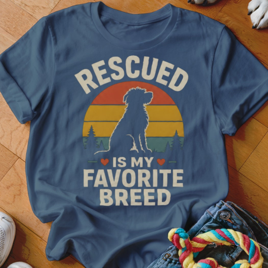 Blue t-shirt with "Rescued is my favorite breed" and dog silhouette graphic.