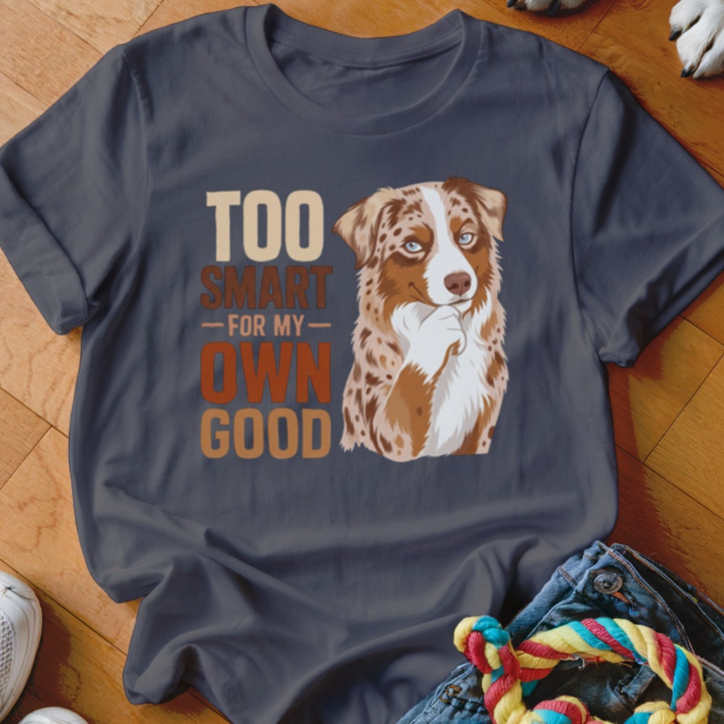 A dark grey t-shirt featuring a graphic of an Australian Shepherd and text reading Too Smart For My Own Good.