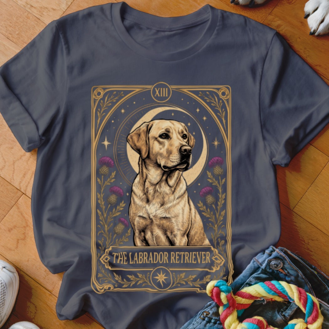 A dark gray t-shirt featuring a tarot card graphic of a Labrador Retriever, moon, and thistles.