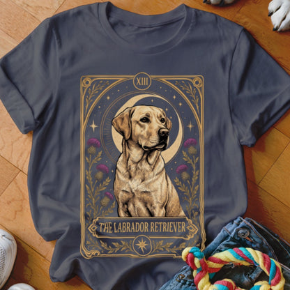 A dark gray t-shirt featuring a tarot card graphic of a Labrador Retriever, moon, and thistles.