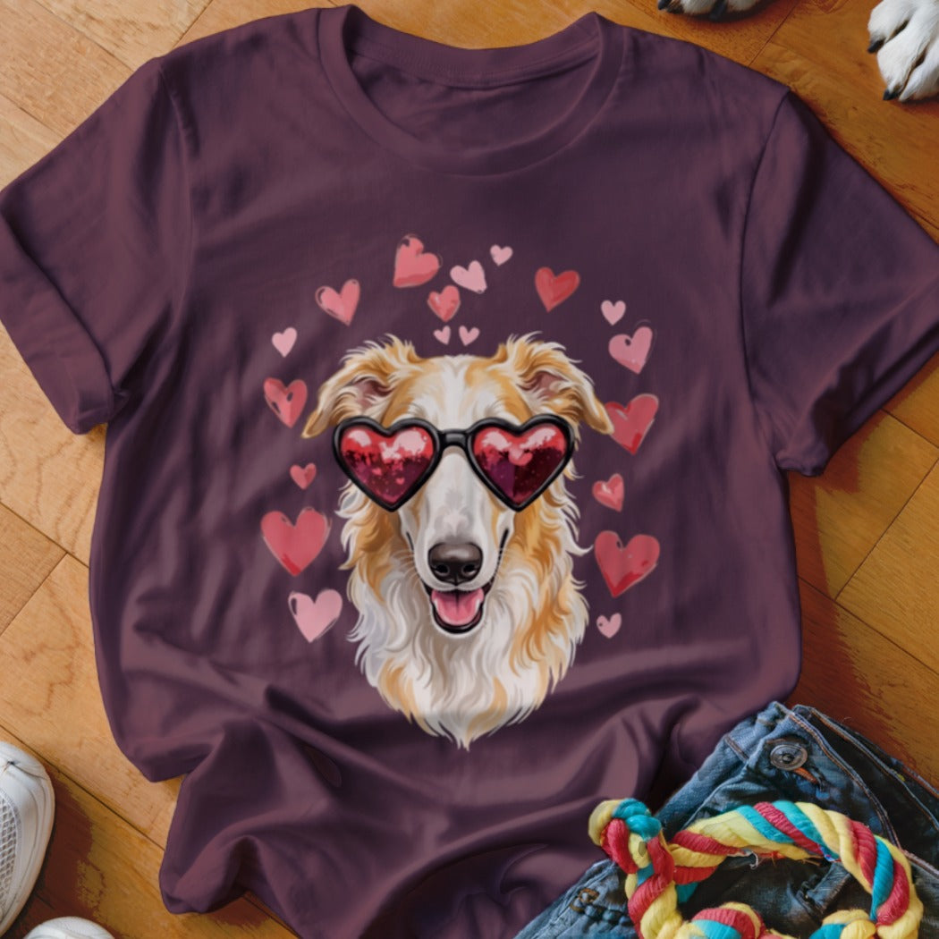 Maroon t-shirt featuring a graphic of a long-snouted dog wearing heart-shaped sunglasses surrounded by pink hearts.