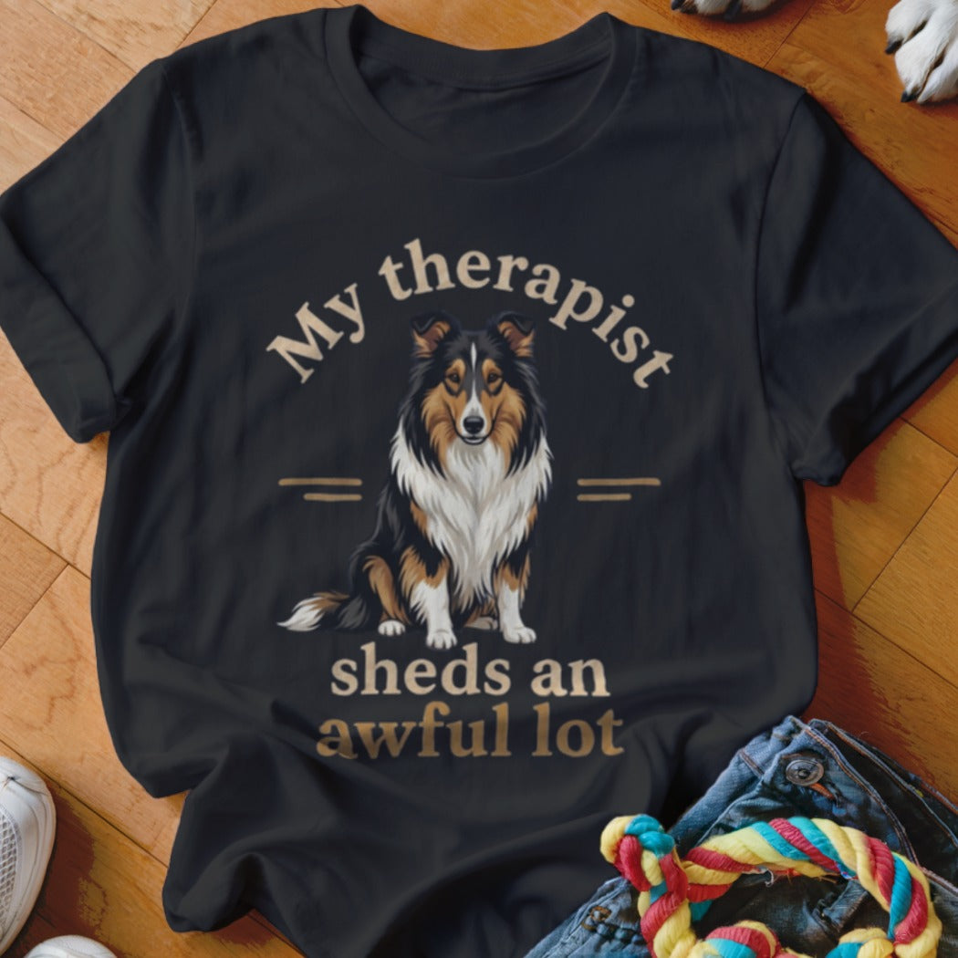 Black t-shirt with a Sheltie dog graphic and the text "My therapist sheds an awful lot".