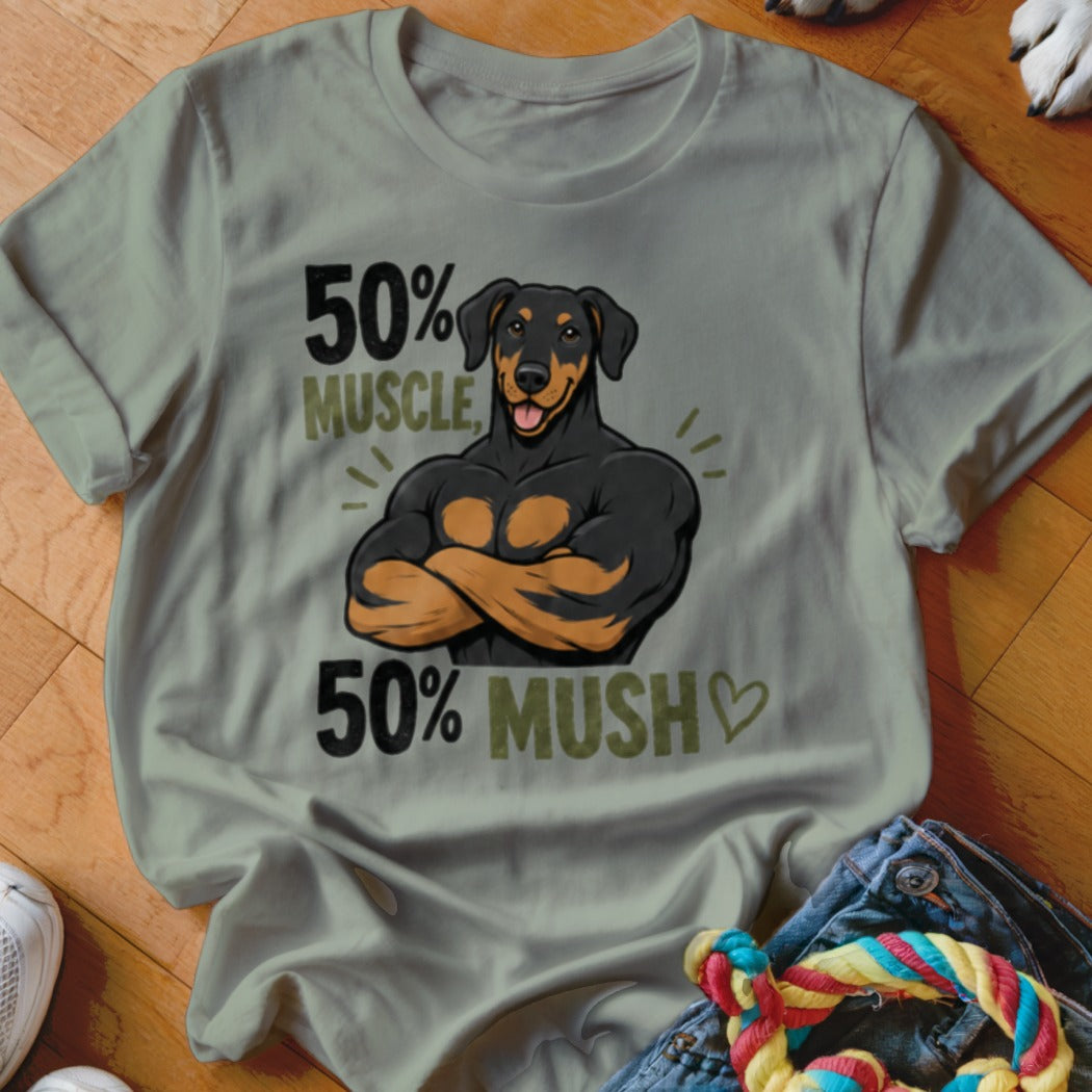 T-shirt graphic of a muscular Doberman with text "50% MUSCLE, 50% MUSH".