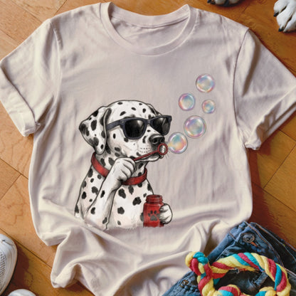 A beige crewneck t-shirt featuring an illustration of a Dalmatian wearing sunglasses and blowing bubbles.
