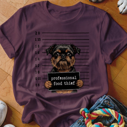 T-shirt with a Brussels Griffon mugshot sign reading "professional food thief".