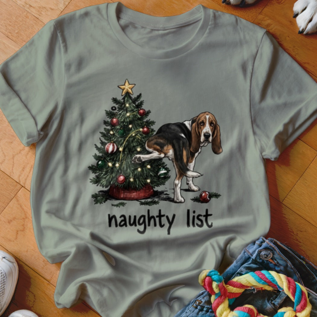 Basset hound near a Christmas tree with text "naughty list".