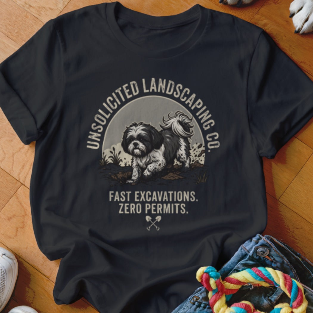 Black t-shirt with Shih Tzu graphic and text "UNSOLICITED LANDSCAPING CO. FAST EXCAVATIONS. ZERO PERMITS."