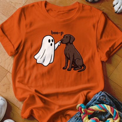 White ghost booping brown dog's nose with "boo-p" text on orange t-shirt.