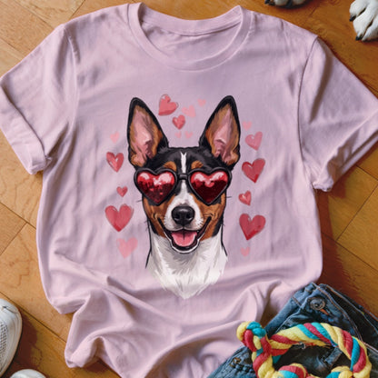 Light pink t-shirt featuring a graphic of a smiling dog wearing heart-shaped sunglasses surrounded by floating hearts.