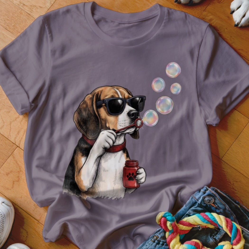 A mauve crewneck t-shirt featuring a graphic of a beagle wearing sunglasses and blowing soap bubbles.