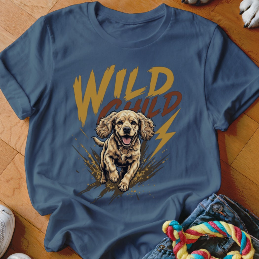 Blue t-shirt featuring a graphic of a running spaniel puppy, mud splatters, and the text WILD CHILD.