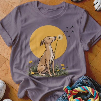 A grey crewneck t-shirt featuring an illustration of a dog blowing dandelion seeds against a yellow circle.