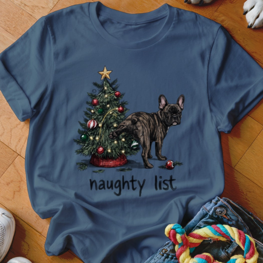 Brindle French Bulldog near a Christmas tree with text "naughty list".