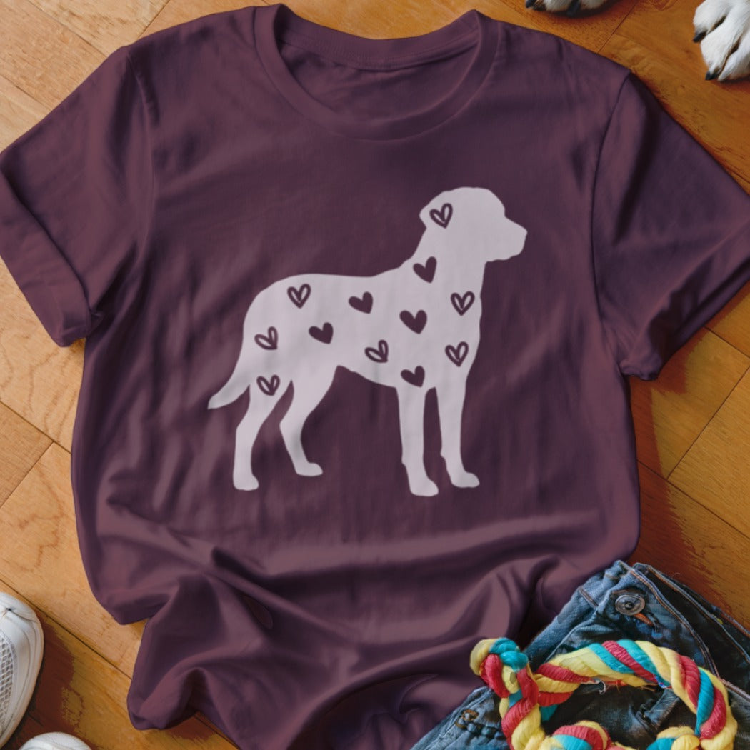 Maroon t-shirt with a white silhouette of a dog covered in dark hearts.