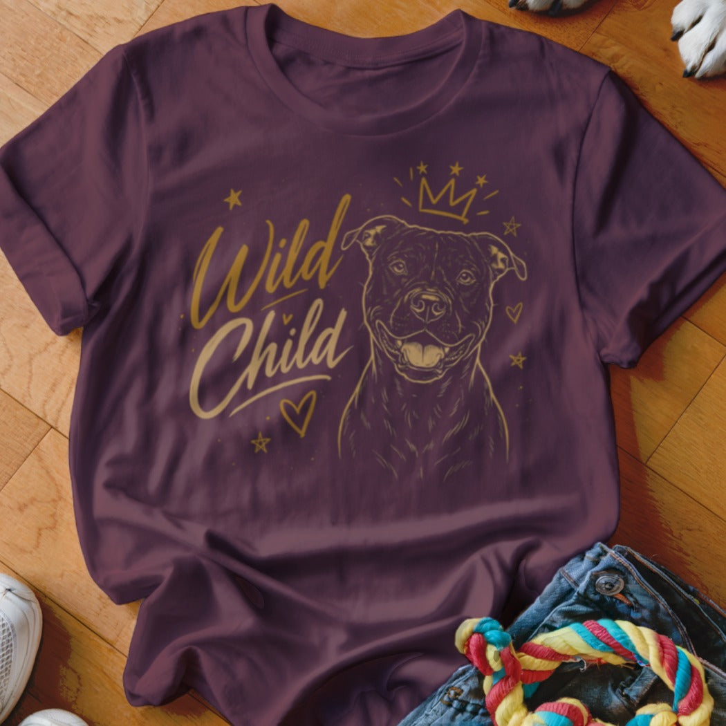 Maroon t-shirt with gold print of a dog wearing a crown and text "Wild Child".