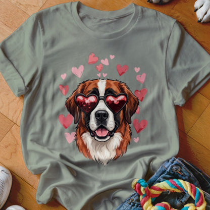 Olive green crewneck t-shirt featuring a Saint Bernard wearing heart-shaped sunglasses surrounded by pink hearts.