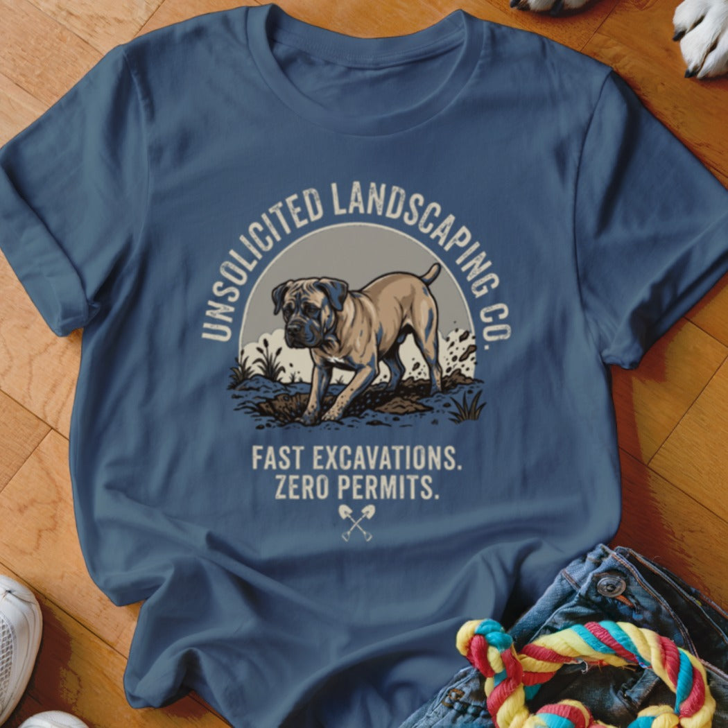 Blue t-shirt with dog digging and text "Unsolicited Landscaping Co."