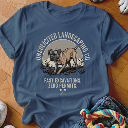 Blue t-shirt with dog digging and text "Unsolicited Landscaping Co."