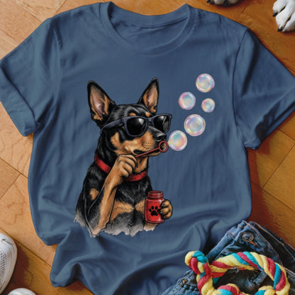 Blue crewneck t-shirt featuring a graphic of a dog wearing sunglasses while blowing bubbles.