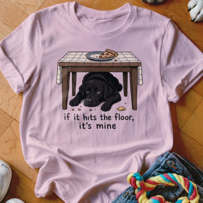 Pink t-shirt with illustration of black lab under table with pizza. Text reads, "if it hits the floor, it's mine."